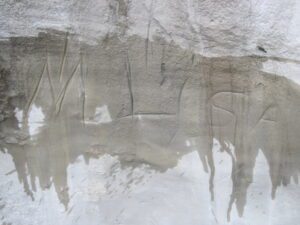 name carving on a sandstone rock