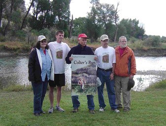 A group of people standing next to each other for Colter’s Run