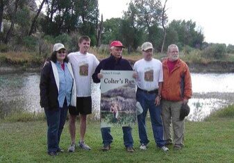 A group of people standing next to each other for Colter’s Run